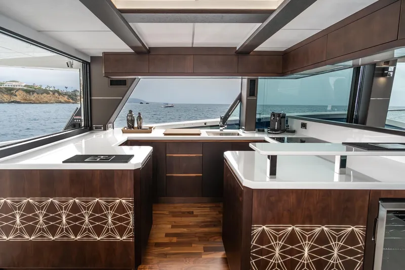  Yacht Photos Pics Luxurious kitchen interior of 2023 Galeon 640 Fly yacht with ocean view.