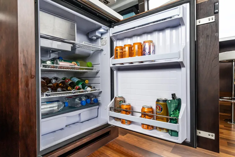  Yacht Photos Pics Open fridge on Galeon 640 Fly yacht, stocked with drinks and beverages, 2023 model.