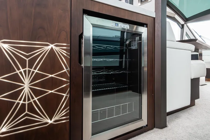  Yacht Photos Pics Luxurious interior of 2023 Galeon 640 Fly yacht featuring a sleek wine cooler.