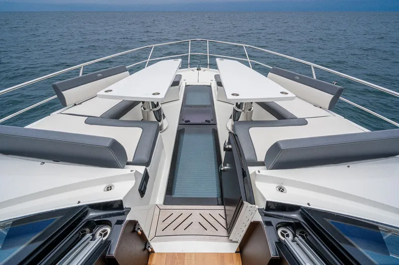  Yacht Photos Pics 2023 Galeon 640 Fly yacht deck with seating and tables, overlooking the ocean.