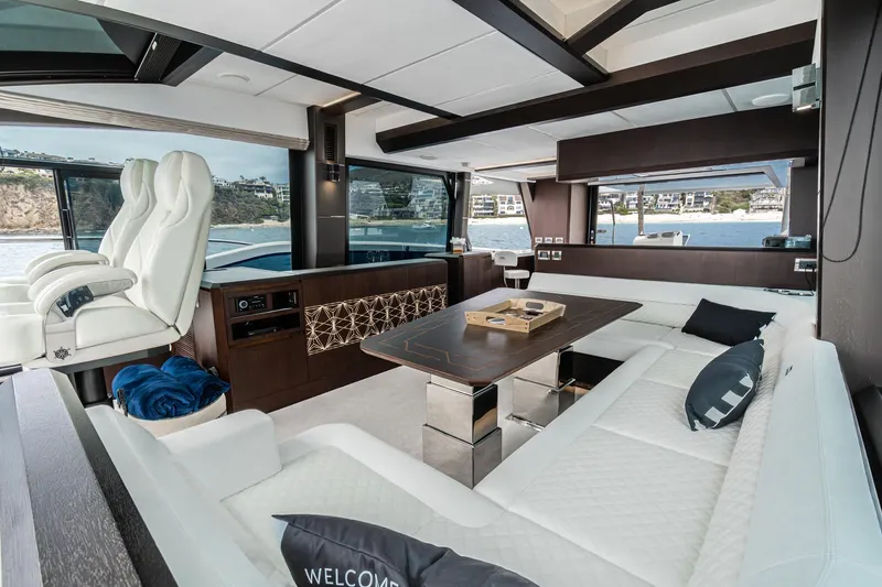  Yacht Photos Pics Luxurious interior of 2023 Galeon 640 Fly yacht with elegant seating and scenic views.