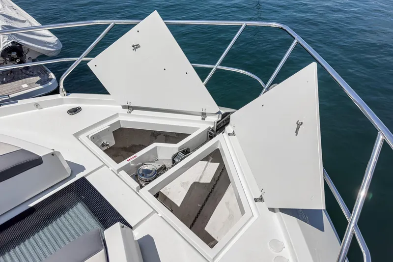  Yacht Photos Pics 2023 Galeon 640 Fly yacht deck with open storage compartments.
