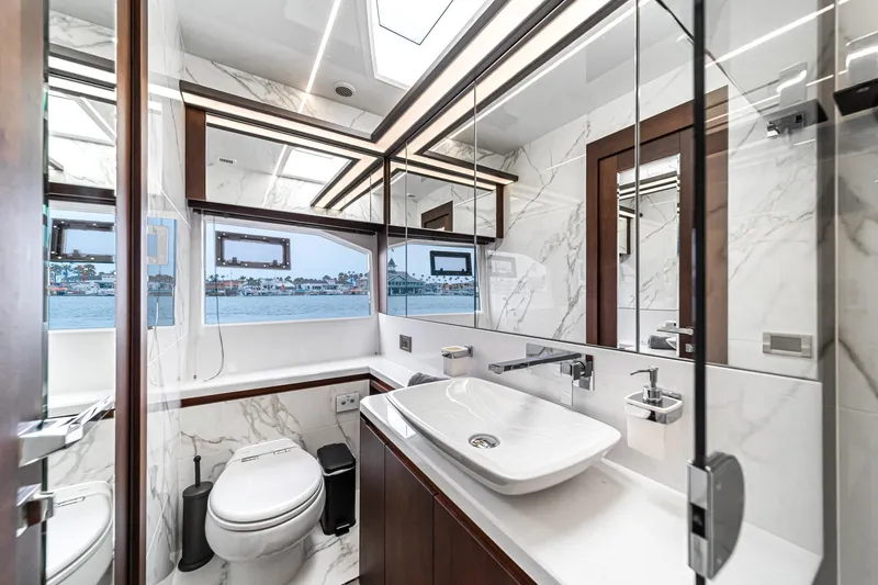  Yacht Photos Pics Luxurious bathroom interior of 2023 Galeon 640 Fly yacht with marble accents and modern fixtures.