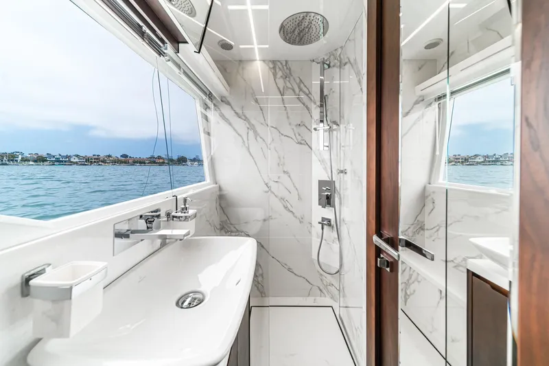  Yacht Photos Pics Luxurious bathroom on 2023 Galeon 640 Fly yacht with marble design and ocean view.