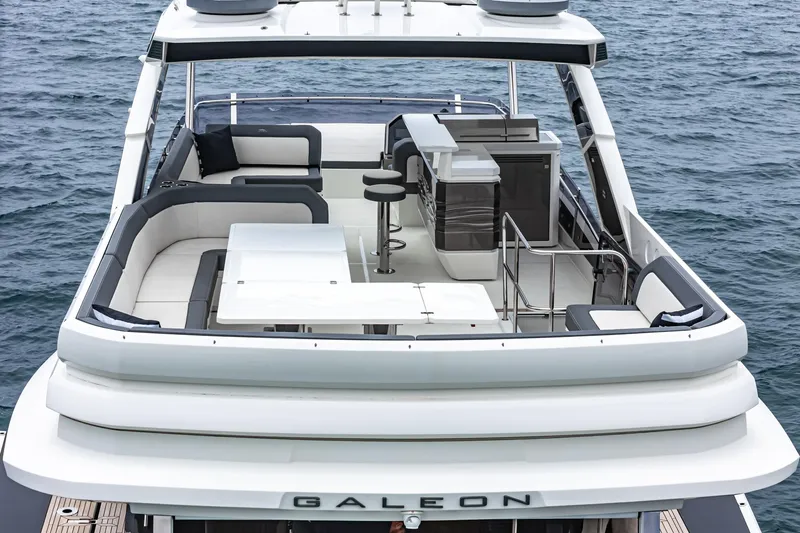  Yacht Photos Pics 2023 Galeon 640 Fly yacht with spacious flybridge and modern seating area.