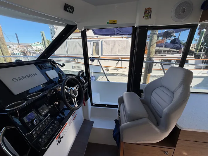  Yacht Photos Pics Interior of 2023 Jeanneau NC 1095 Fly with helm console.