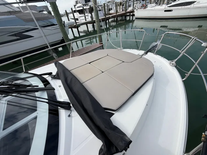  Yacht Photos Pics 2023 Jeanneau NC 1095 Fly with sun deck at marina.