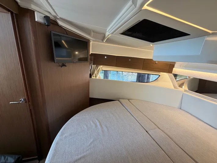  Yacht Photos Pics Interior of 2023 Jeanneau NC 1095 Fly with bed and TV.
