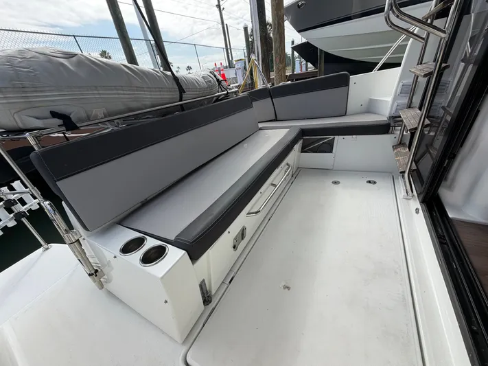  Yacht Photos Pics Jeanneau NC 1095 Fly 2023, spacious deck with seating and cup holders.