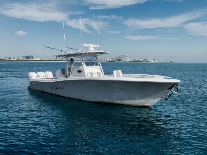 T/t No Shortcuts Yacht Photos Pics 2020 Invincible Open Fisherman boat on calm ocean waters.