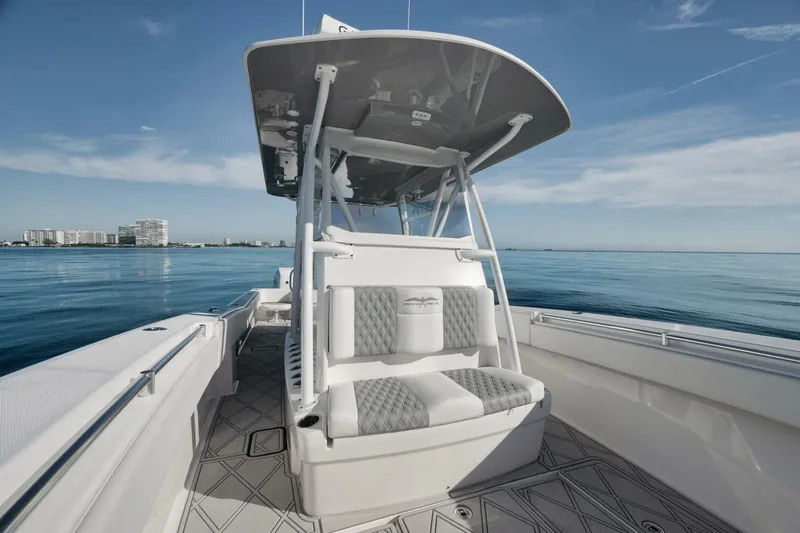 T/t No Shortcuts Yacht Photos Pics 2020 Invincible Open Fisherman boat on calm ocean waters.