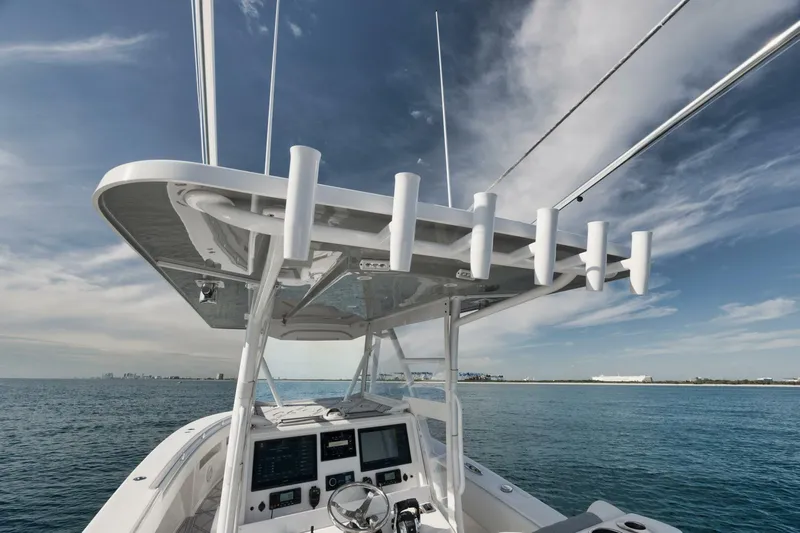 T/t No Shortcuts Yacht Photos Pics 2020 Invincible Open Fisherman boat on calm sea with clear sky.