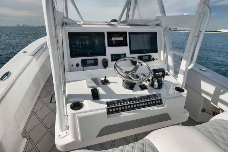 T/t No Shortcuts Yacht Photos Pics 2020 Invincible Open Fisherman boat console with advanced navigation and control systems.