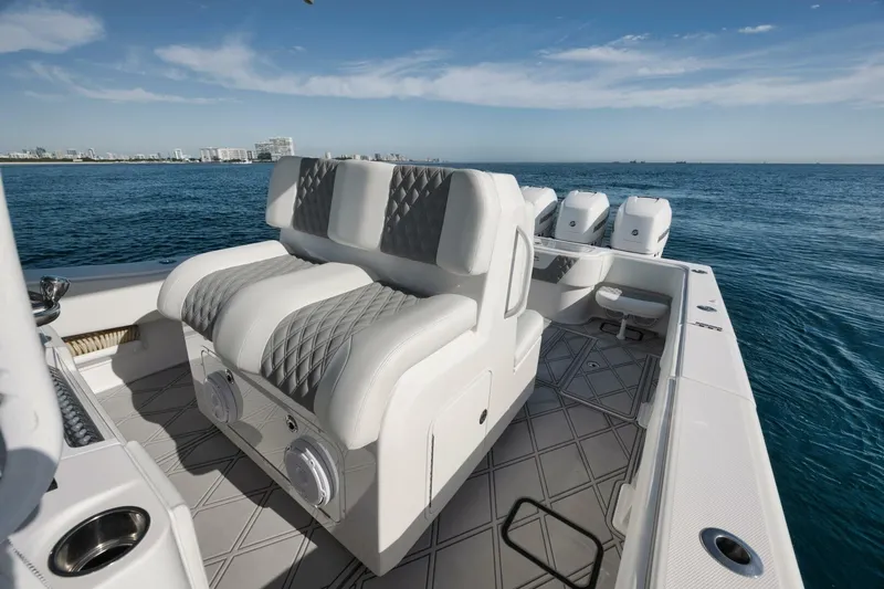 T/t No Shortcuts Yacht Photos Pics 2020 Invincible Open Fisherman boat with luxurious seating on open water.