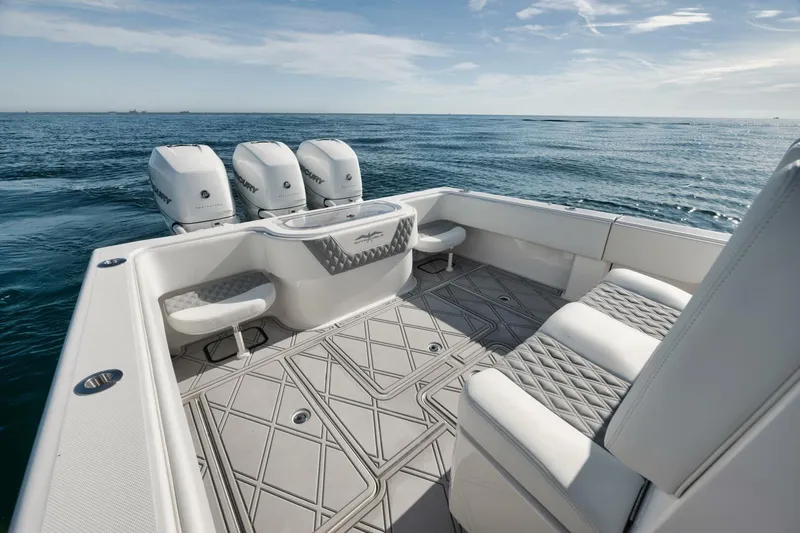 T/t No Shortcuts Yacht Photos Pics 2020 Invincible Open Fisherman boat with triple engines on open sea.