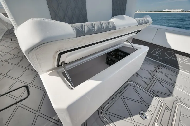 T/t No Shortcuts Yacht Photos Pics 2020 Invincible Open Fisherman boat with open storage compartment on deck.