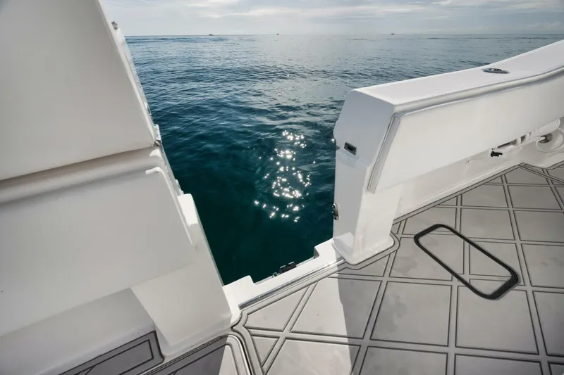 T/t No Shortcuts Yacht Photos Pics 2020 Invincible Open Fisherman boat deck overlooking calm ocean waters.