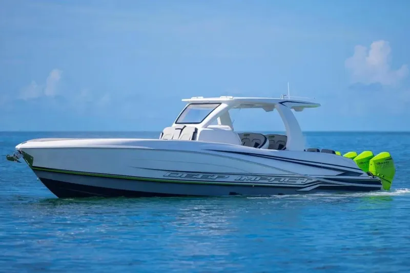  Yacht Photos Pics 2026 Deep Impact 399 Sport boat cruising on clear blue water.