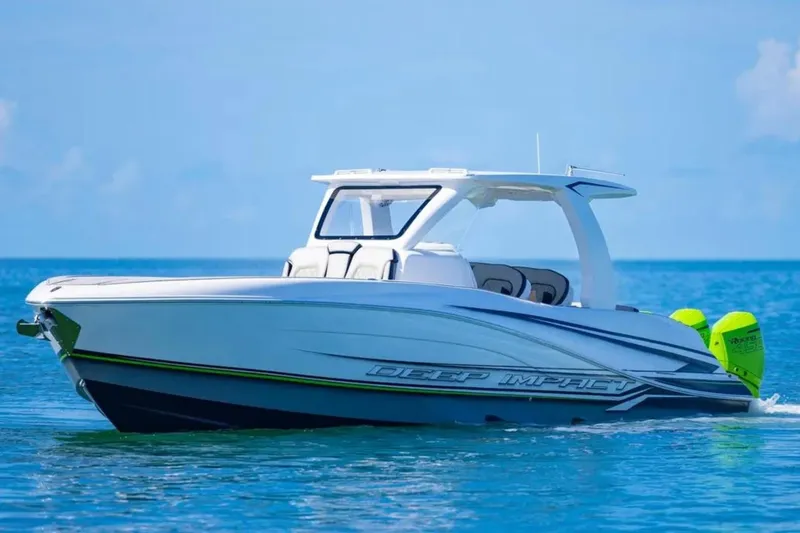  Yacht Photos Pics 2026 Deep Impact 399 Sport boat cruising on clear blue water.