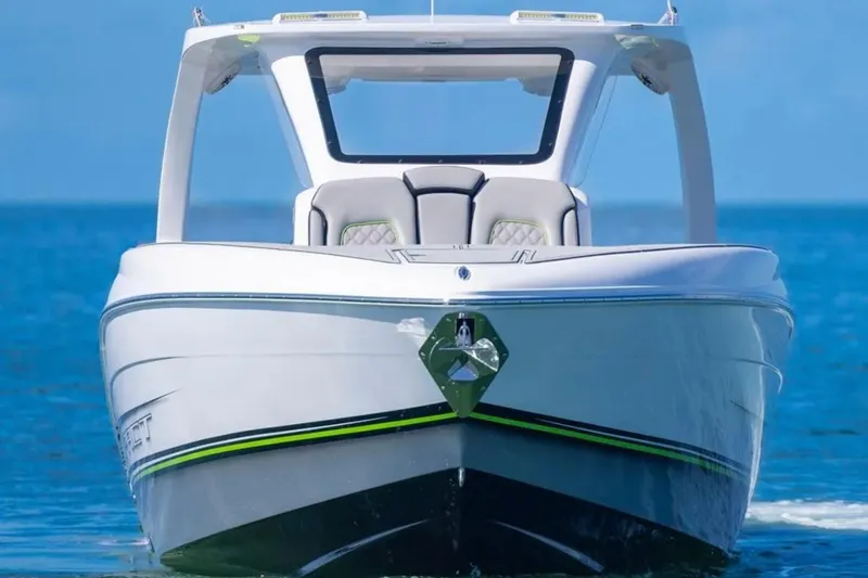  Yacht Photos Pics 2026 Deep Impact 399 Sport boat on clear blue water, front view.