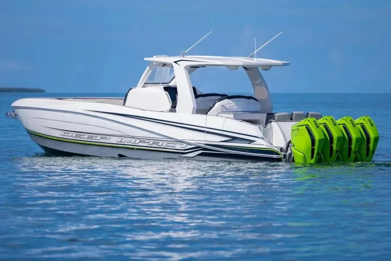  Yacht Photos Pics 2026 Deep Impact 399 Sport boat with vibrant green engines on calm blue water.