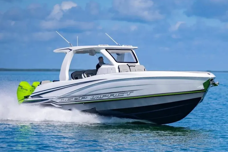  Yacht Photos Pics 2026 Deep Impact 399 Sport boat cruising on open water, showcasing sleek design and powerful engines.
