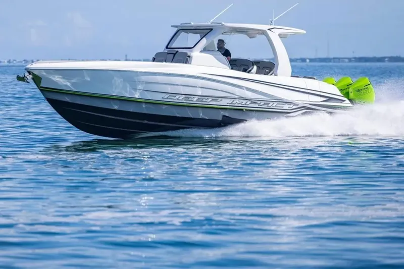  Yacht Photos Pics 2026 Deep Impact 399 Sport boat cruising on open water, showcasing sleek design and performance.