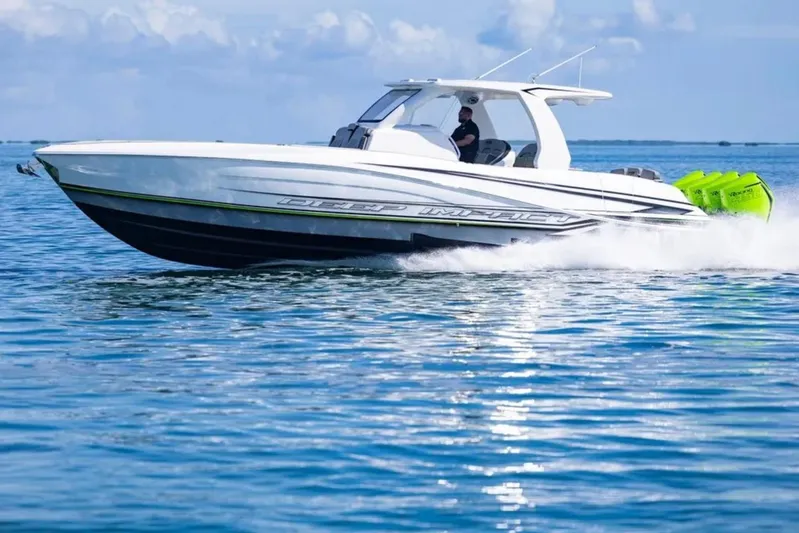  Yacht Photos Pics 2026 Deep Impact 399 Sport boat cruising on clear blue water.