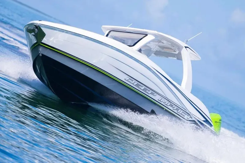  Yacht Photos Pics 2026 Deep Impact 399 Sport boat cruising on clear blue water.