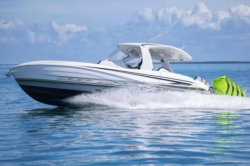  Yacht Photos Pics 2026 Deep Impact 399 Sport boat cruising on calm blue waters.