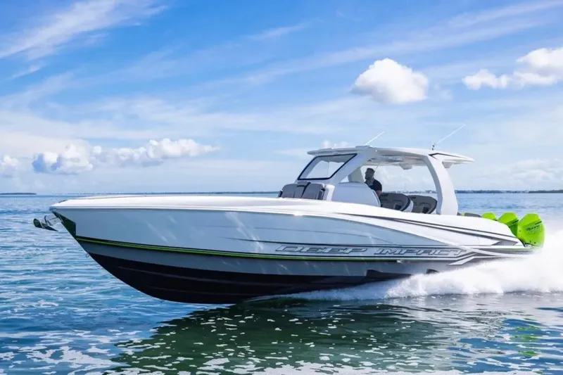  Yacht Photos Pics 2026 Deep Impact 399 Sport boat cruising on open water under a clear blue sky.
