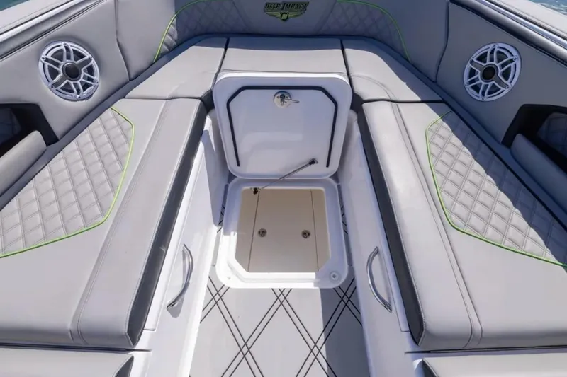  Yacht Photos Pics Luxury seating area on 2026 Deep Impact 399 Sport boat with storage compartment.