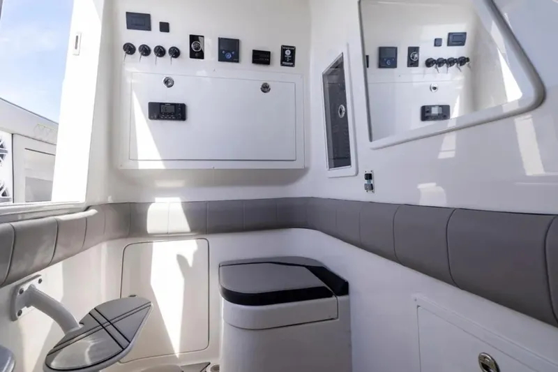  Yacht Photos Pics Interior of 2026 Deep Impact 399 Sport boat, featuring modern control panel and seating.