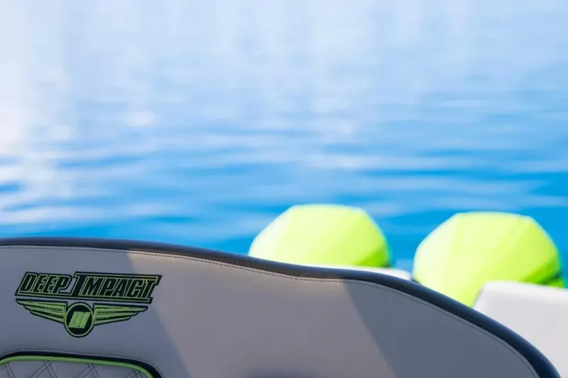  Yacht Photos Pics 2026 Deep Impact 399 Sport boat on calm blue water, featuring logo detail.