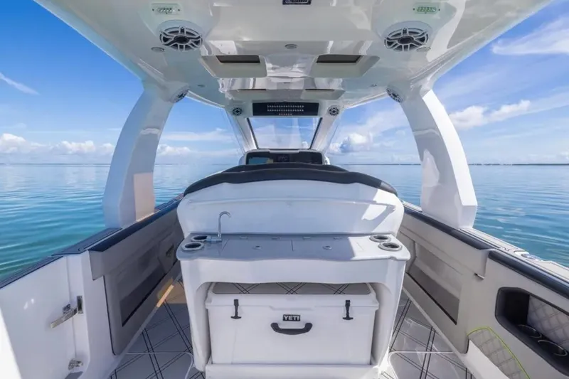  Yacht Photos Pics Interior view of 2026 Deep Impact 399 Sport boat on calm ocean waters.