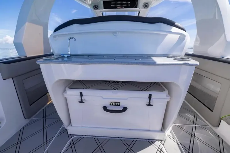  Yacht Photos Pics 2026 Deep Impact 399 Sport boat interior with Yeti cooler and sink.