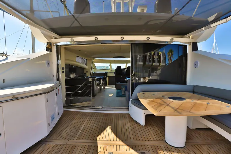 Black Zen Yacht Photos Pics Luxurious 2006 Sunseeker Predator 82 yacht interior with sleek design and spacious seating area.