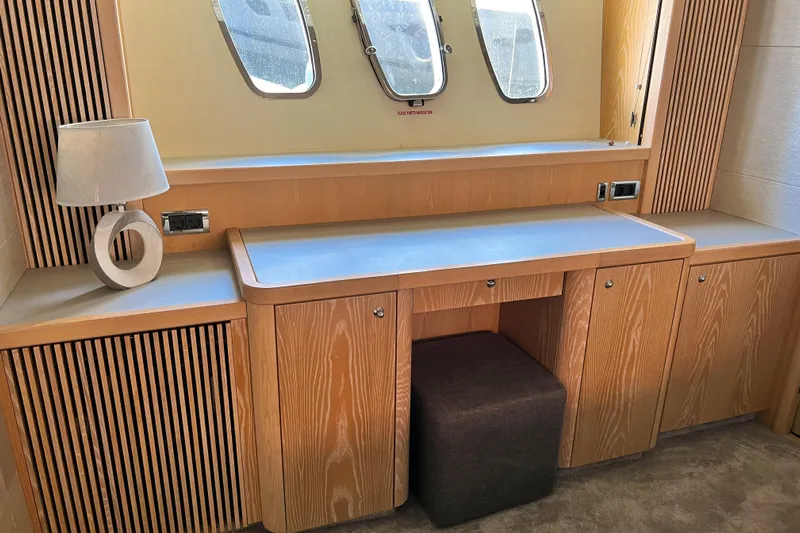 Black Zen Yacht Photos Pics Luxurious interior of 2006 Sunseeker Predator 82 yacht with wooden cabinetry and modern decor.