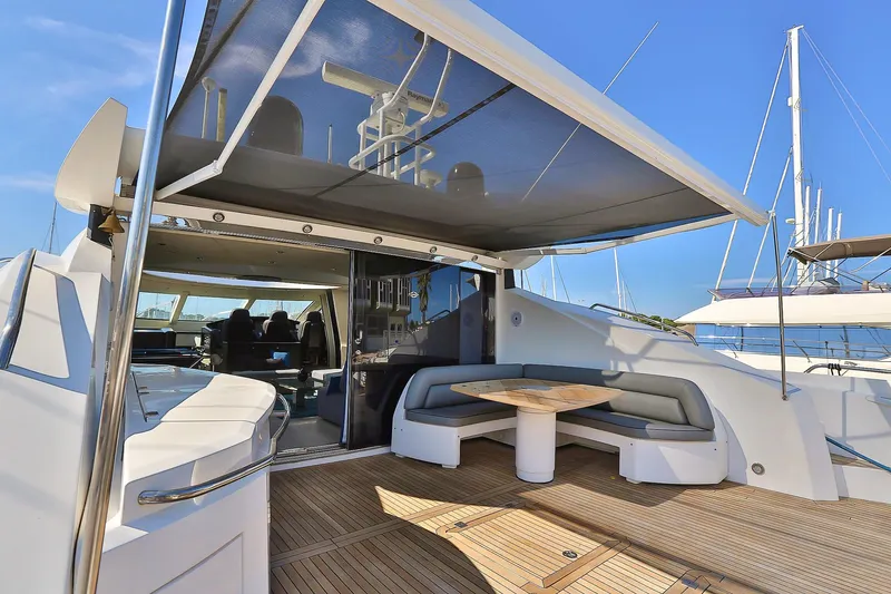 Black Zen Yacht Photos Pics Luxurious 2006 Sunseeker Predator 82 yacht with spacious outdoor seating and sleek design.