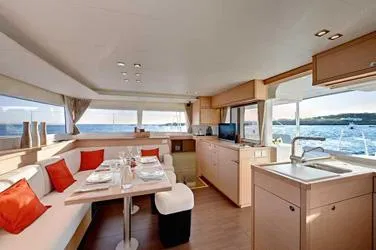 Panui Yacht Photos Pics Interior of 2019 Lagoon 450S catamaran with modern kitchen and dining area, ocean view.