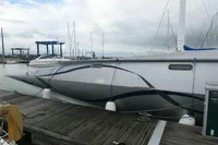 Custom 2007 VSV boat docked at marina, featuring sleek design and modern aesthetics.
