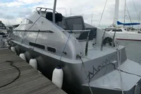 Custom VSV 2007 boat docked at marina with fenders and sleek design.