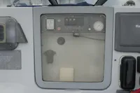 Control panel of a 2007 Custom VSV boat with gauges and switches.