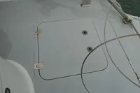 Hatch on a 2007 Custom VSV boat deck with metal hinges and rope detail.
