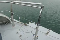 Stainless steel boat railing on a Custom VSV, 2007, overlooking calm water.