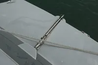 Custom VSV 2007 boat deck with metal fittings and rope, on calm water.