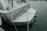 Sleek 2007 Custom VSV yacht docked, featuring modern design and secure mooring ropes.