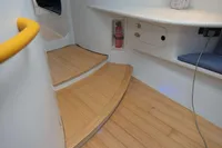 Interior of a 2007 Custom VSV with wooden steps and safety equipment.