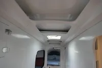 Interior view of a 2007 Custom VSV vehicle, featuring a sleek white design.