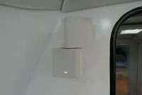 Wall-mounted white speakers inside a 2007 Custom VSV vehicle.
